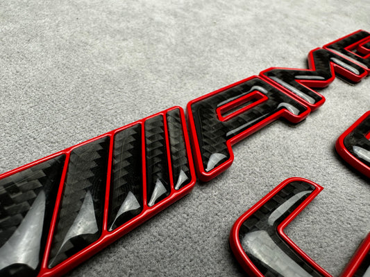 AMG C 63 S red metal with carbon emblem badge for Mercedes C-Class (W204, W205, W206), exterior styling upgrade