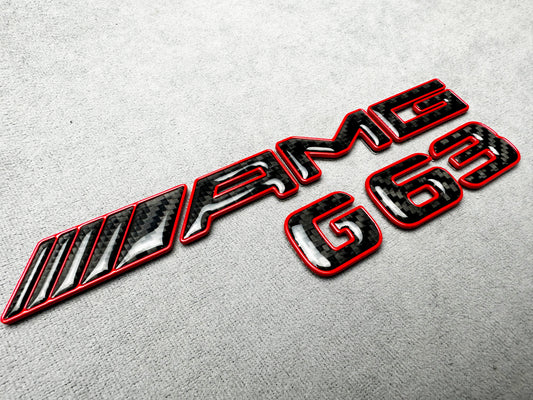 AMG G63 red metallic with carbon emblem badge for Mercedes G-Class W465, premium finish, easy installation