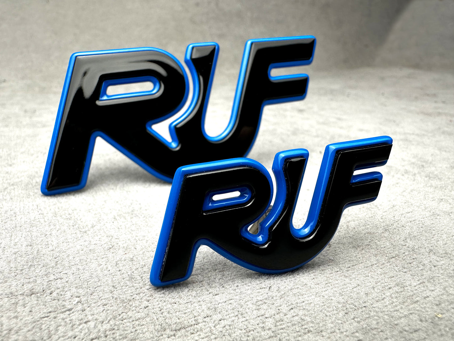 Close-up of black with blue RUF badge for Porsche classic models