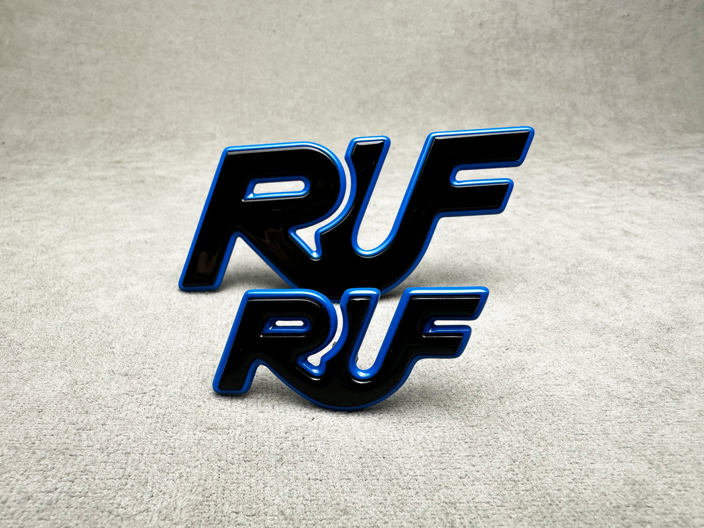 Stylish black and blue RUF emblems for Porsche 911 models – high-performance look