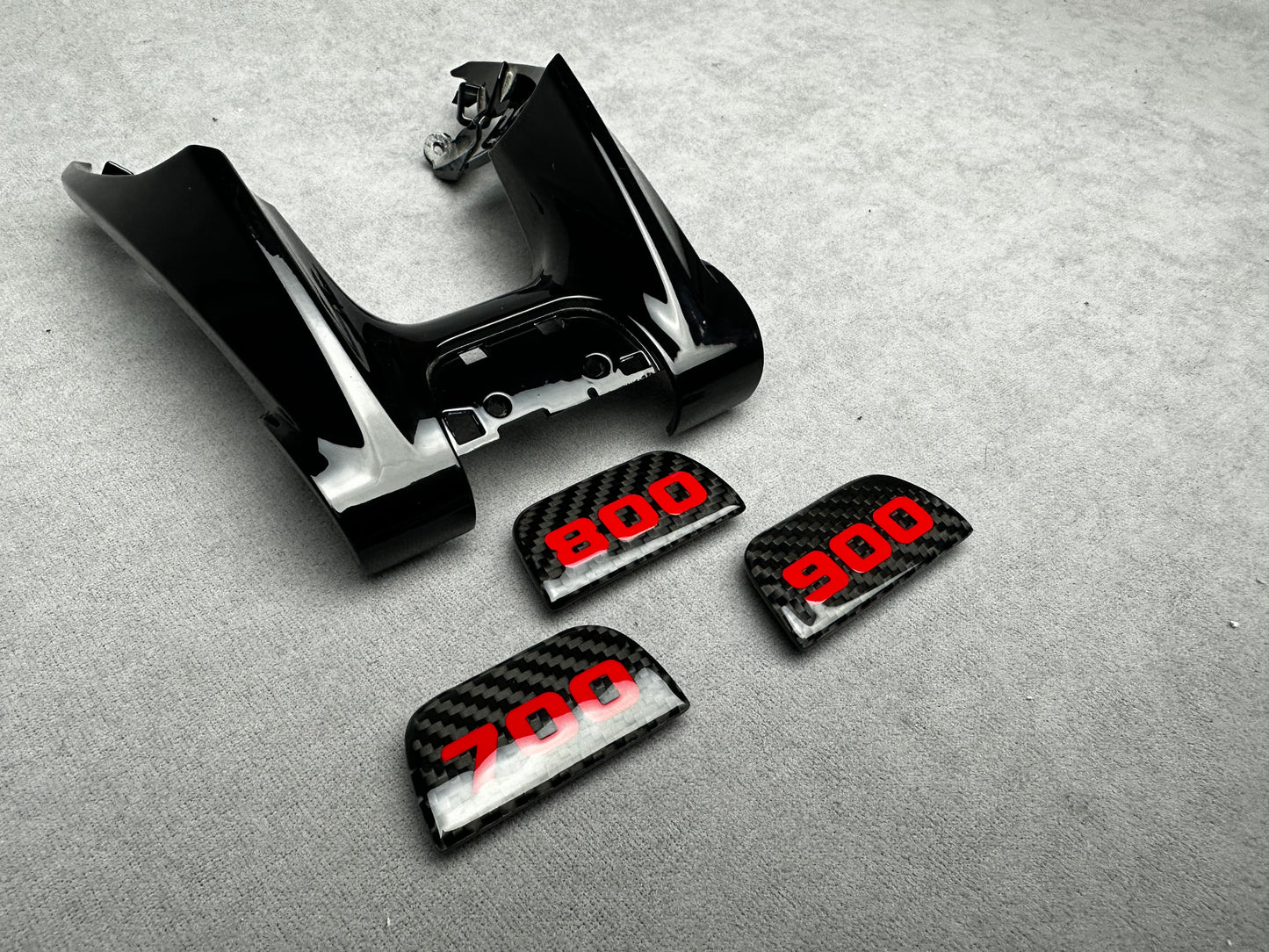 Luxury Brabus flat carbon steering wheel emblem with "700" sign for high-performance cars