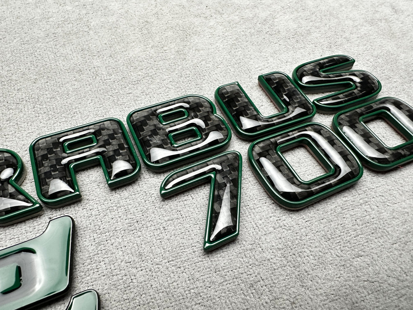 Brabus 700 Mean Green Metal with Carbon Trunk Badge Emblem for Mercedes W465 G-Wagon – premium styling with a high-performance carbon finish