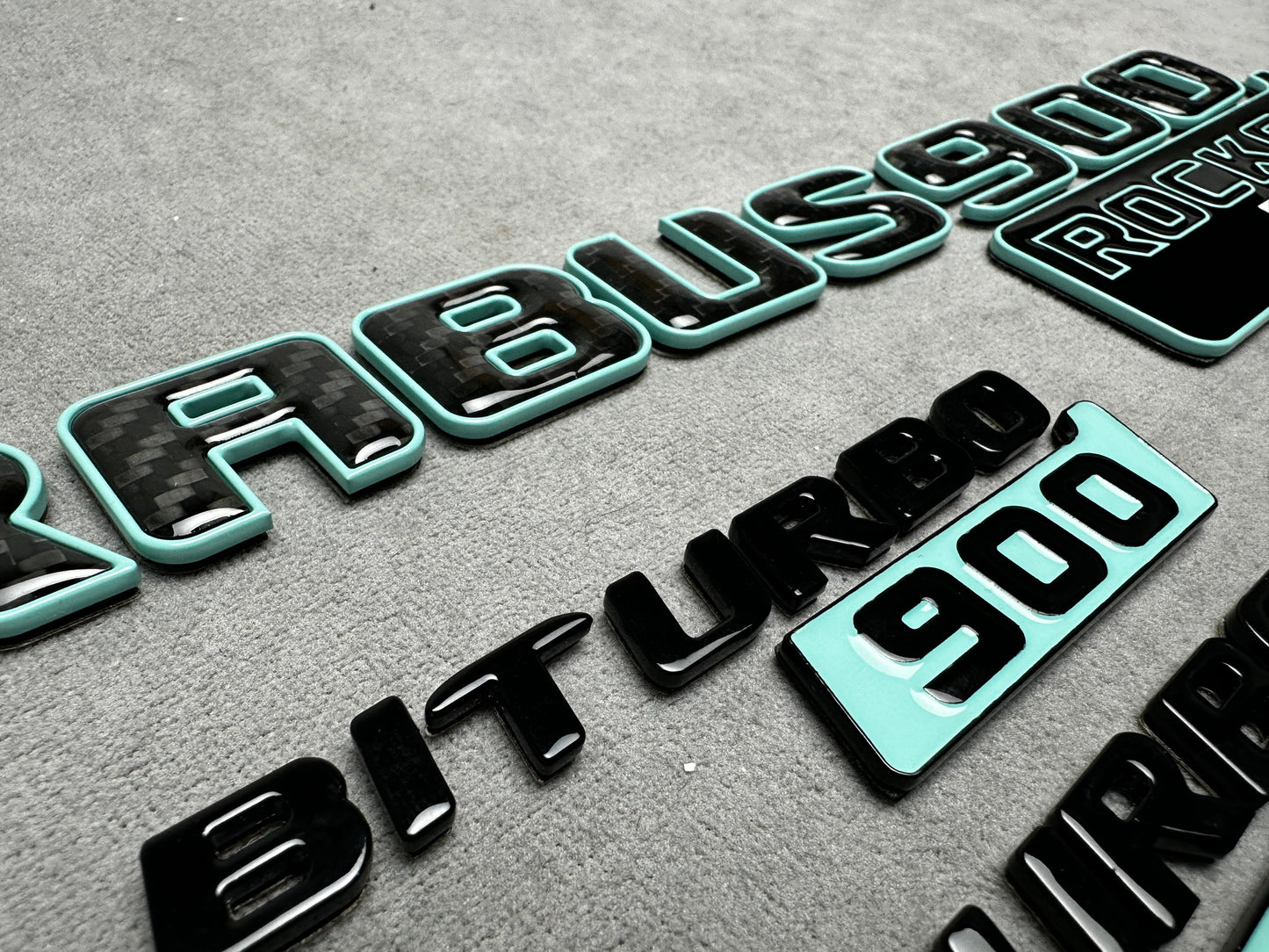 Brabus 900 Rocket Edition emblem badge set in Tiffany blue with carbon fiber accents for Mercedes G-Wagon W463A, premium quality, easy installation