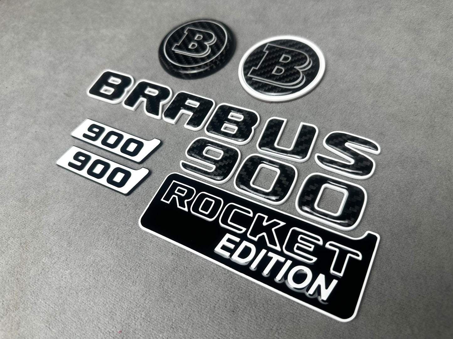Brabus 900 Rocket Edition White Metal and Carbon Emblem Set for Mercedes W463A – Full set of badges featuring premium white metal and carbon fiber accents