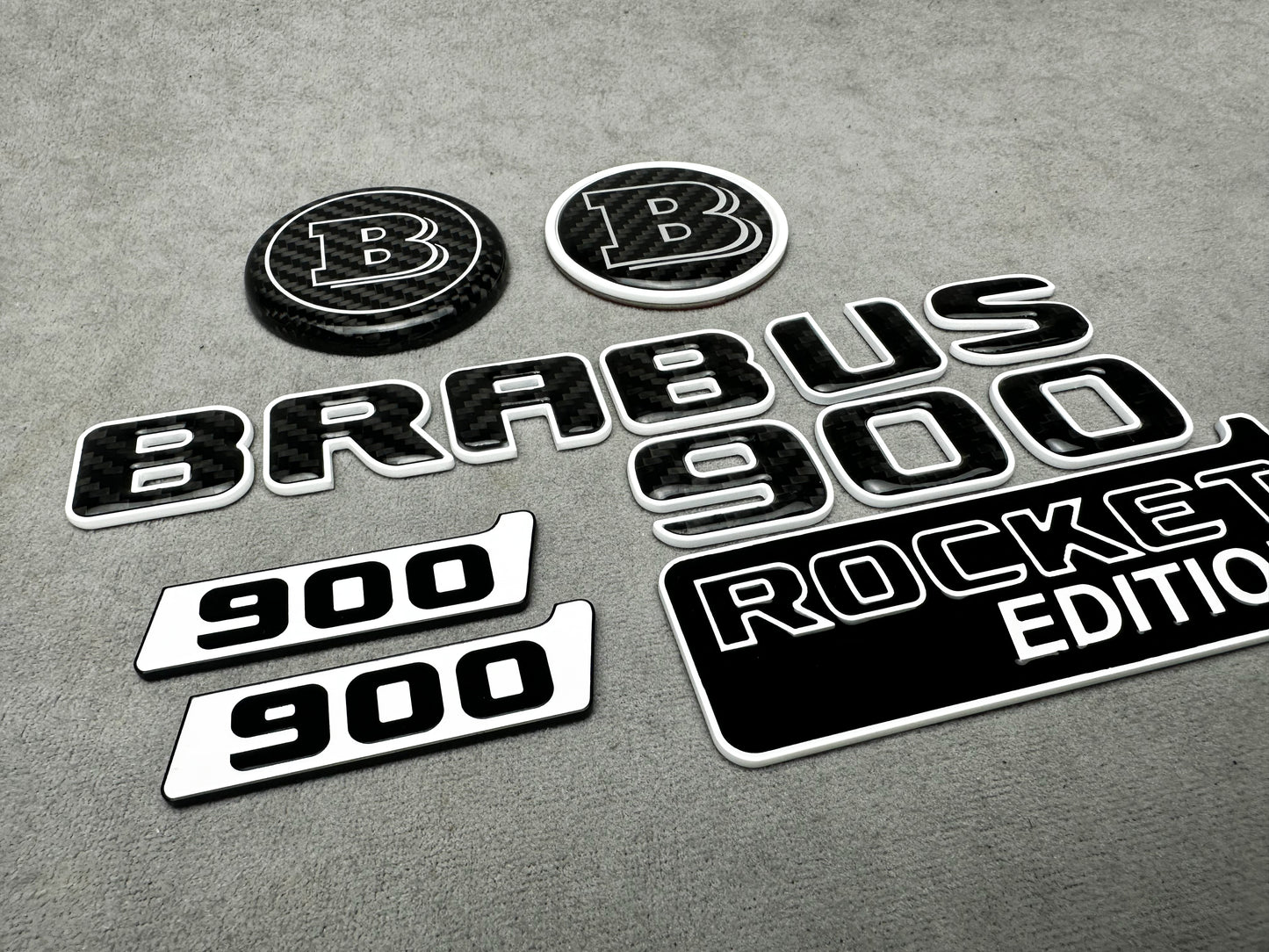 Brabus 900 Rocket Edition White Metal and Carbon Emblem Set for Mercedes W463A – Full set of badges featuring premium white metal and carbon fiber accents