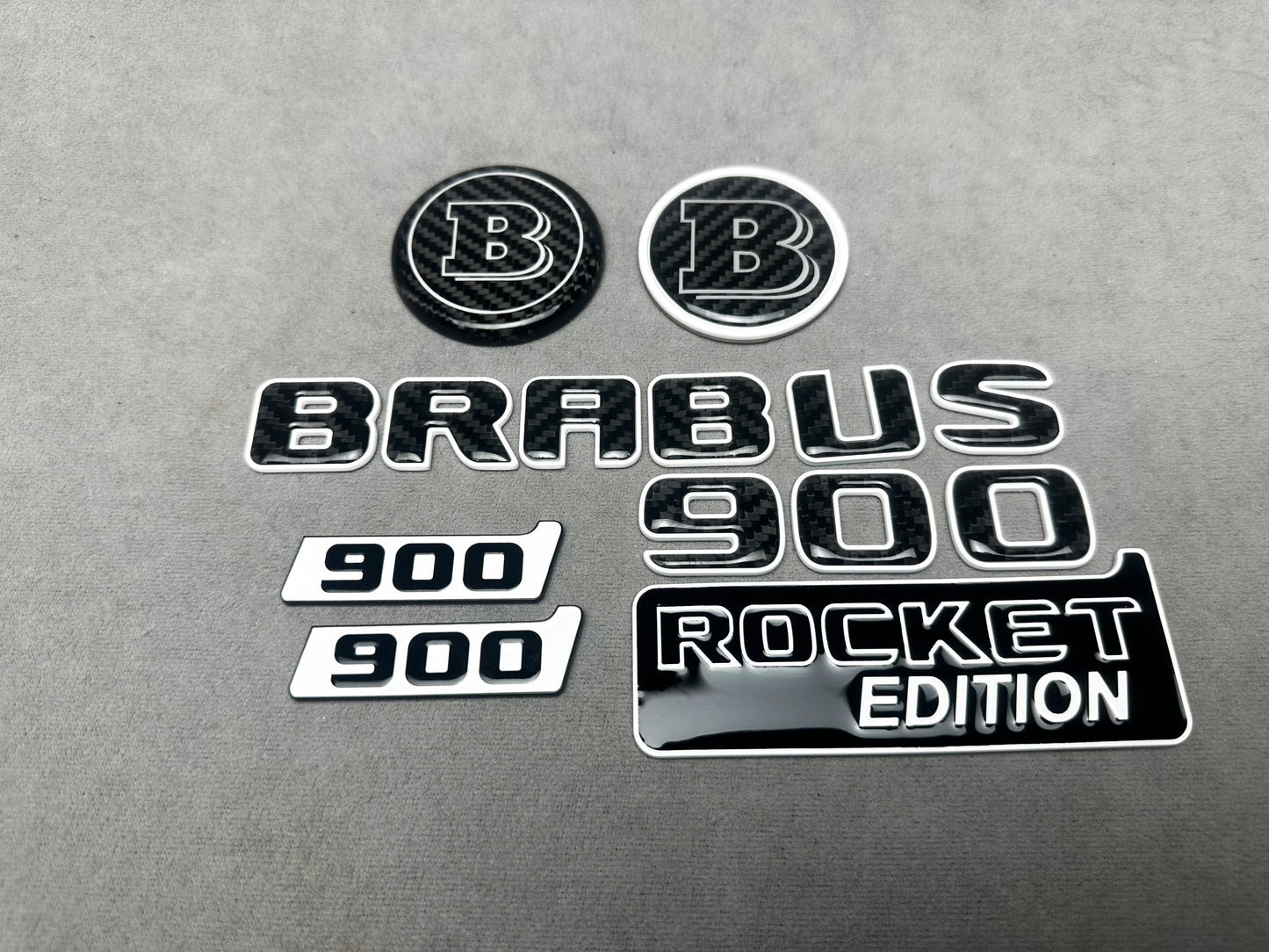 Brabus 900 Rocket Edition White Metal and Carbon Emblem Set for Mercedes W463A – Full set of badges featuring premium white metal and carbon fiber accents