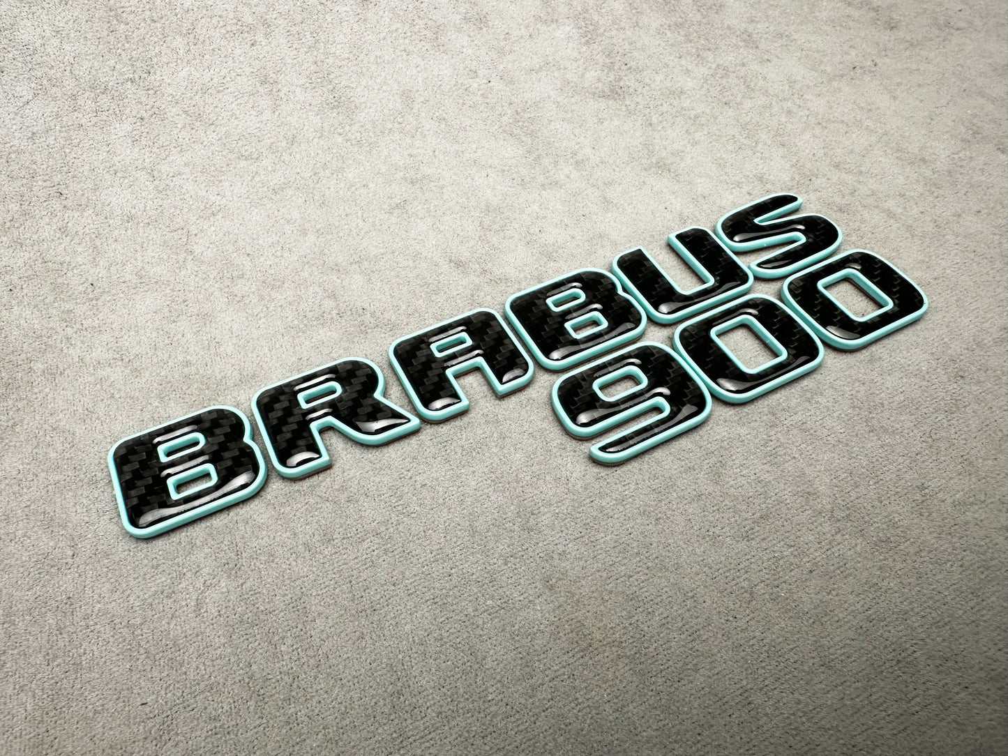 Brabus 900 Tiffany Blue Trunk Emblem Badge ā Mercedes Upgrade ā Premium metal and carbon fiber badge for Mercedes trunk, featuring a bold Tiffany blue finish