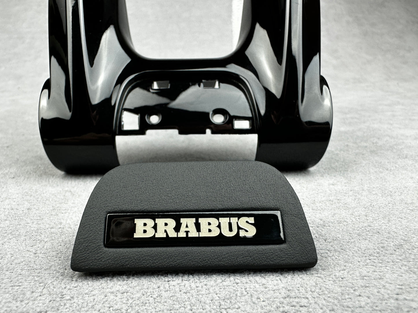 Close-up of Brabus Black Leather Steering Wheel Emblem with Black Plastic Badge for Mercedes
