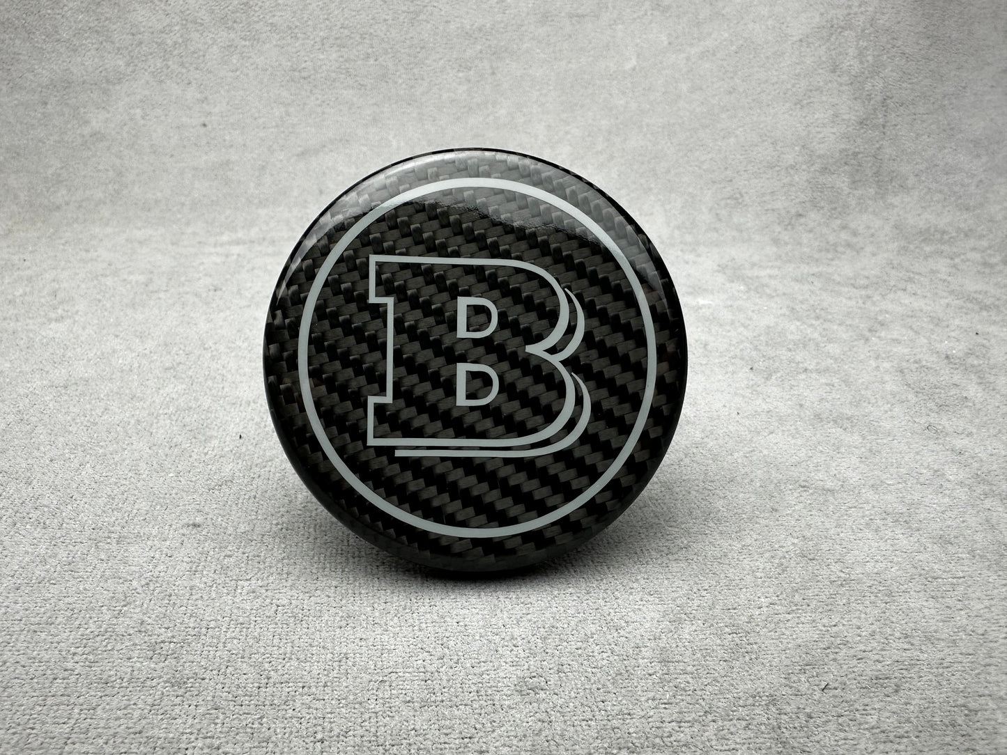 Brabus carbon grey emblem for Mercedes steering wheel, airbag logo with sleek design, perfect for G-W465, S-W223, GLE, and GLS models