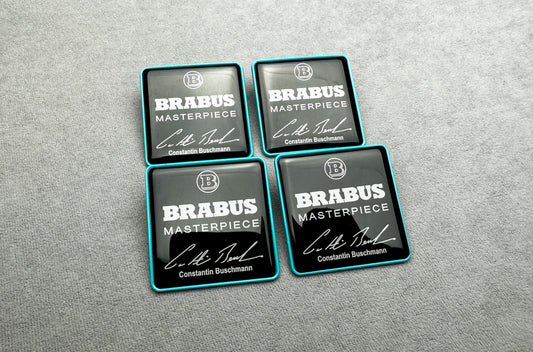 Close-up of Brabus Masterpiece seat emblems with premium black and Tiffany blue finish