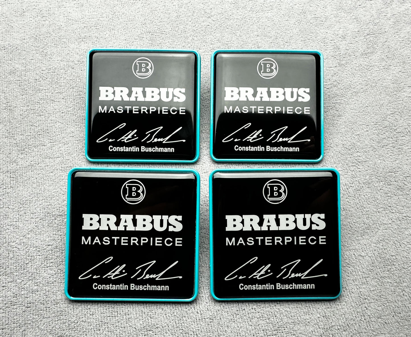 Black and Tiffany blue Brabus Masterpiece seat emblems for high-performance interiors