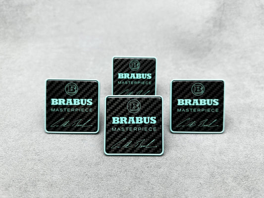 Close-up of Brabus Masterpiece seat emblems with premium carbon and Tiffany blue finish