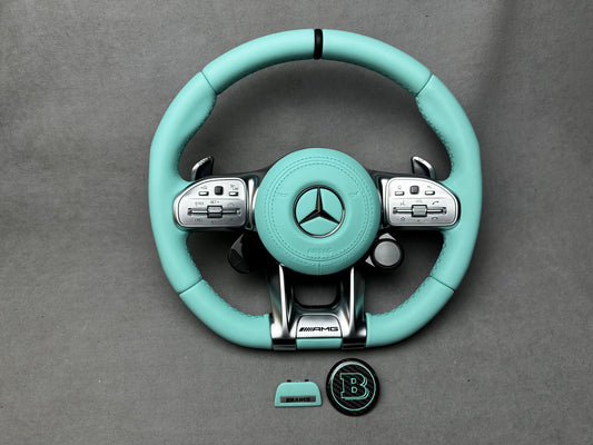 Premium Brabus Tiffany Blue interior steering wheel badge set with leather, metal, and carbon fiber details