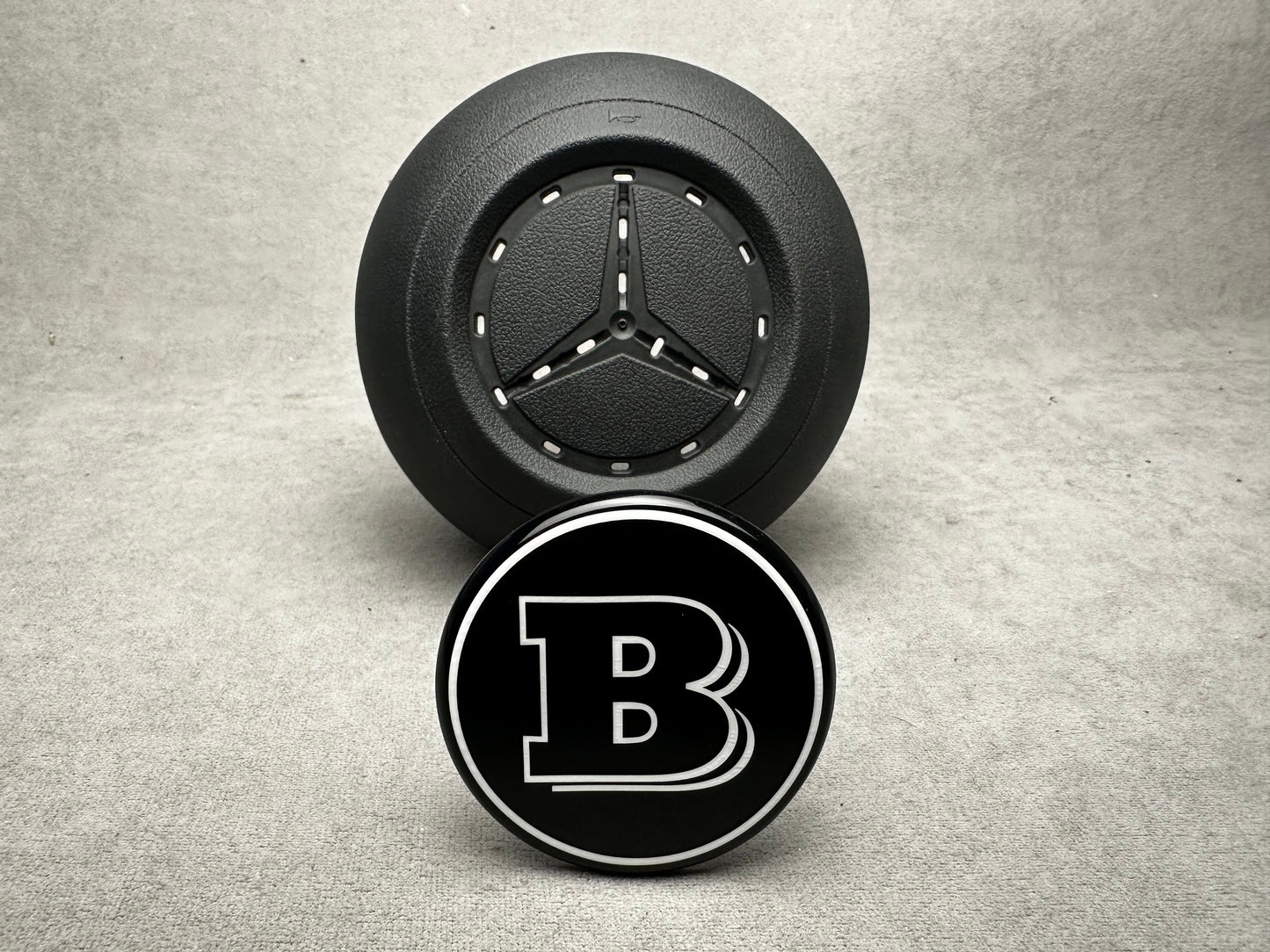 Brabus black emblem for airbag steering wheel, compatible with 2024+ Mercedes G-W465, S-W223, GLE, GLS models, sleek modern design