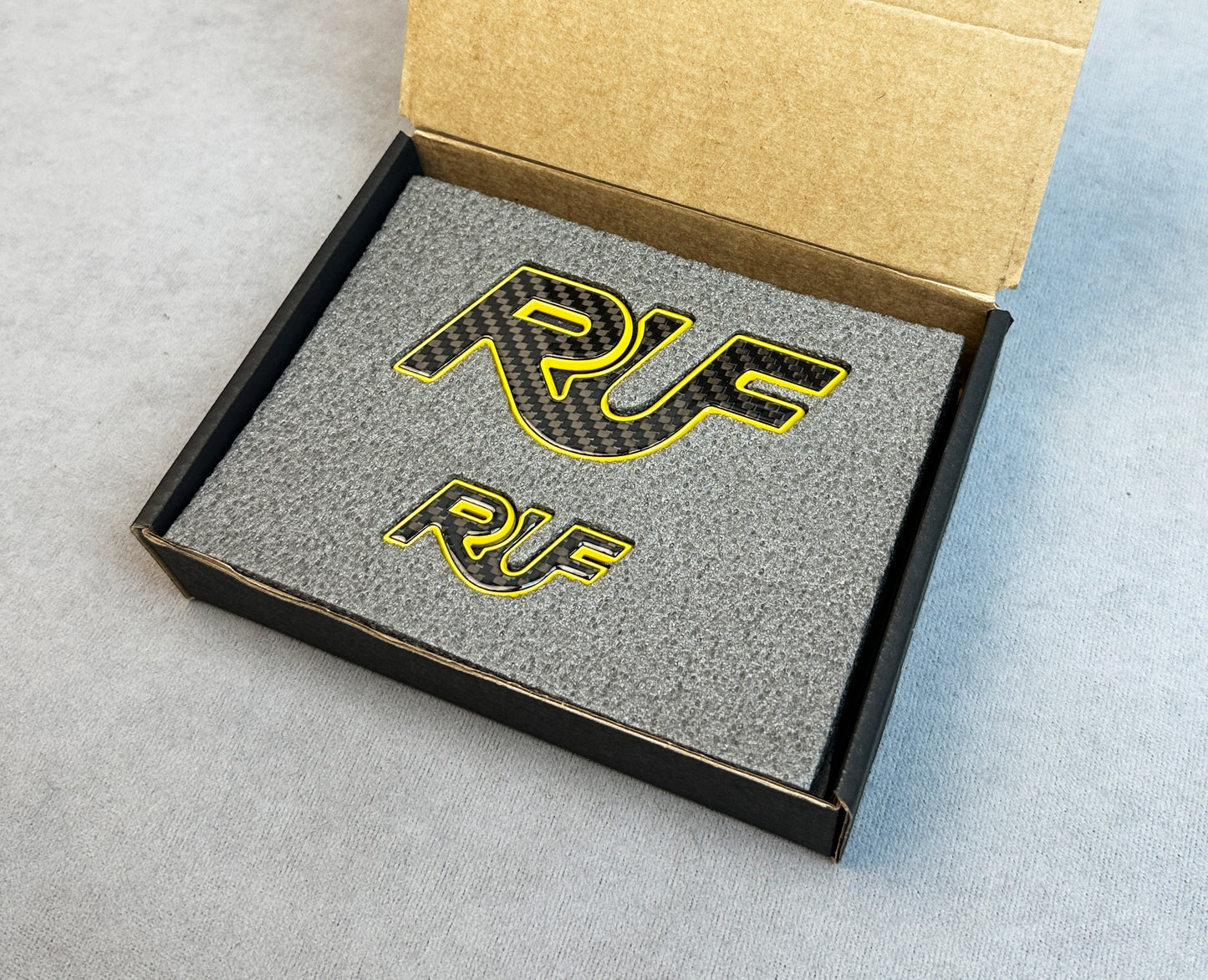 Yellow RUF emblem for Porsche carbon tuning setup