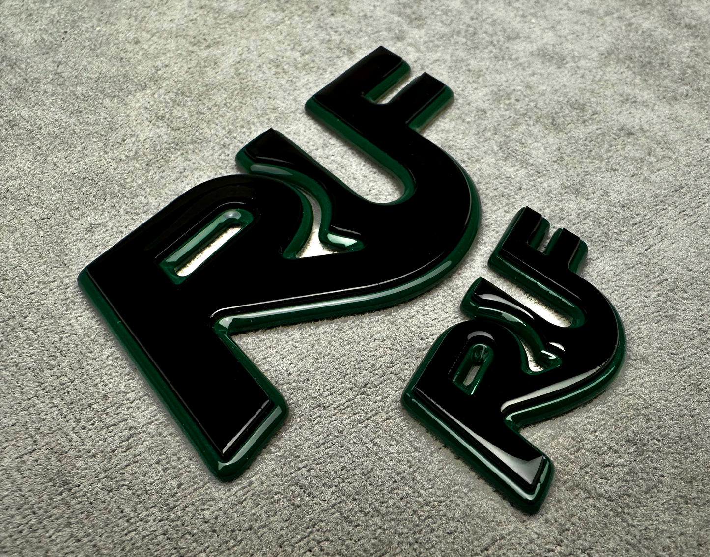 Porsche 997 with installed mean green and black RUF metal emblem for performance styling