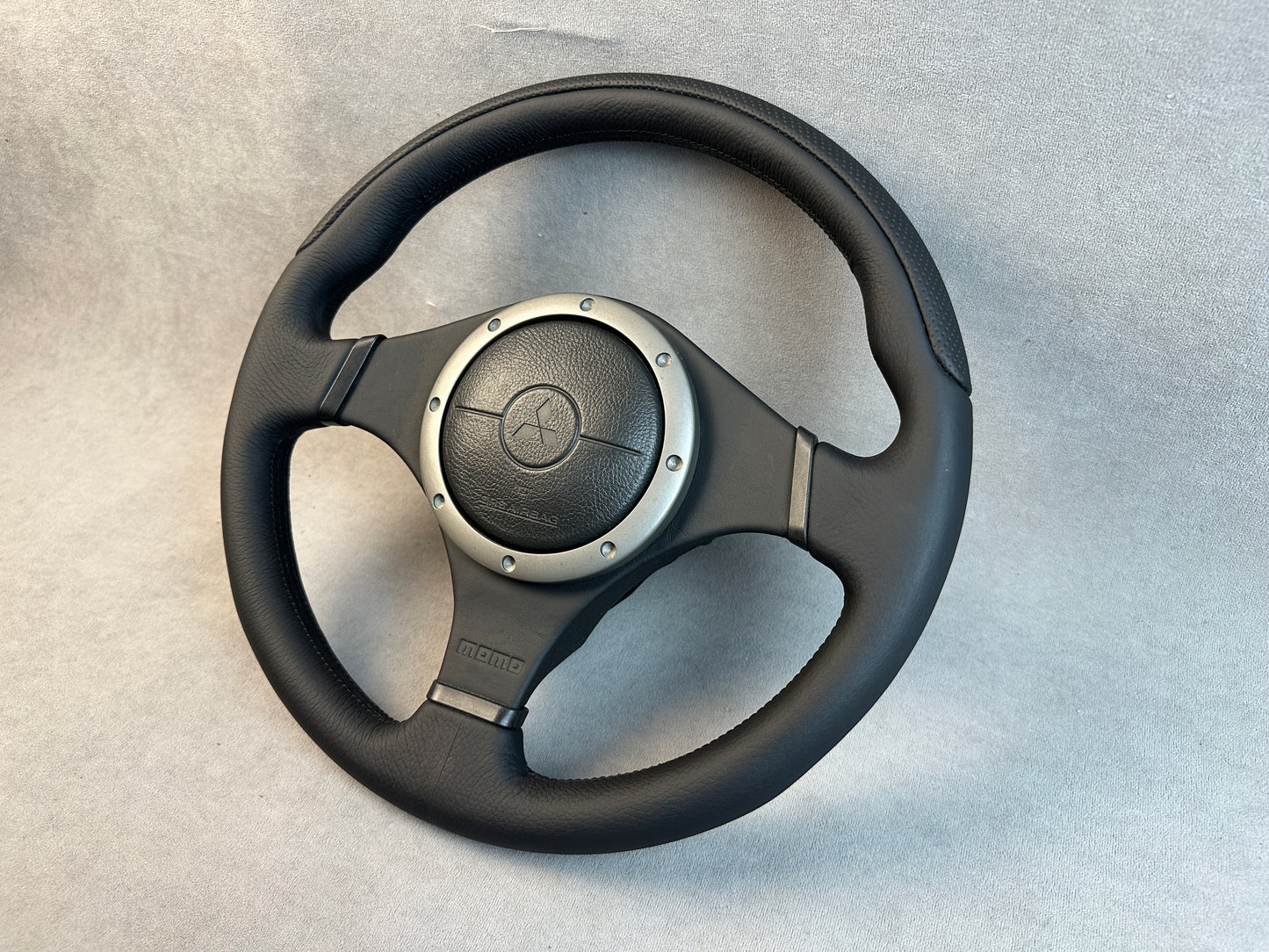 Mitsubishi Evo 9 MOMO steering wheel with factory leather wrap