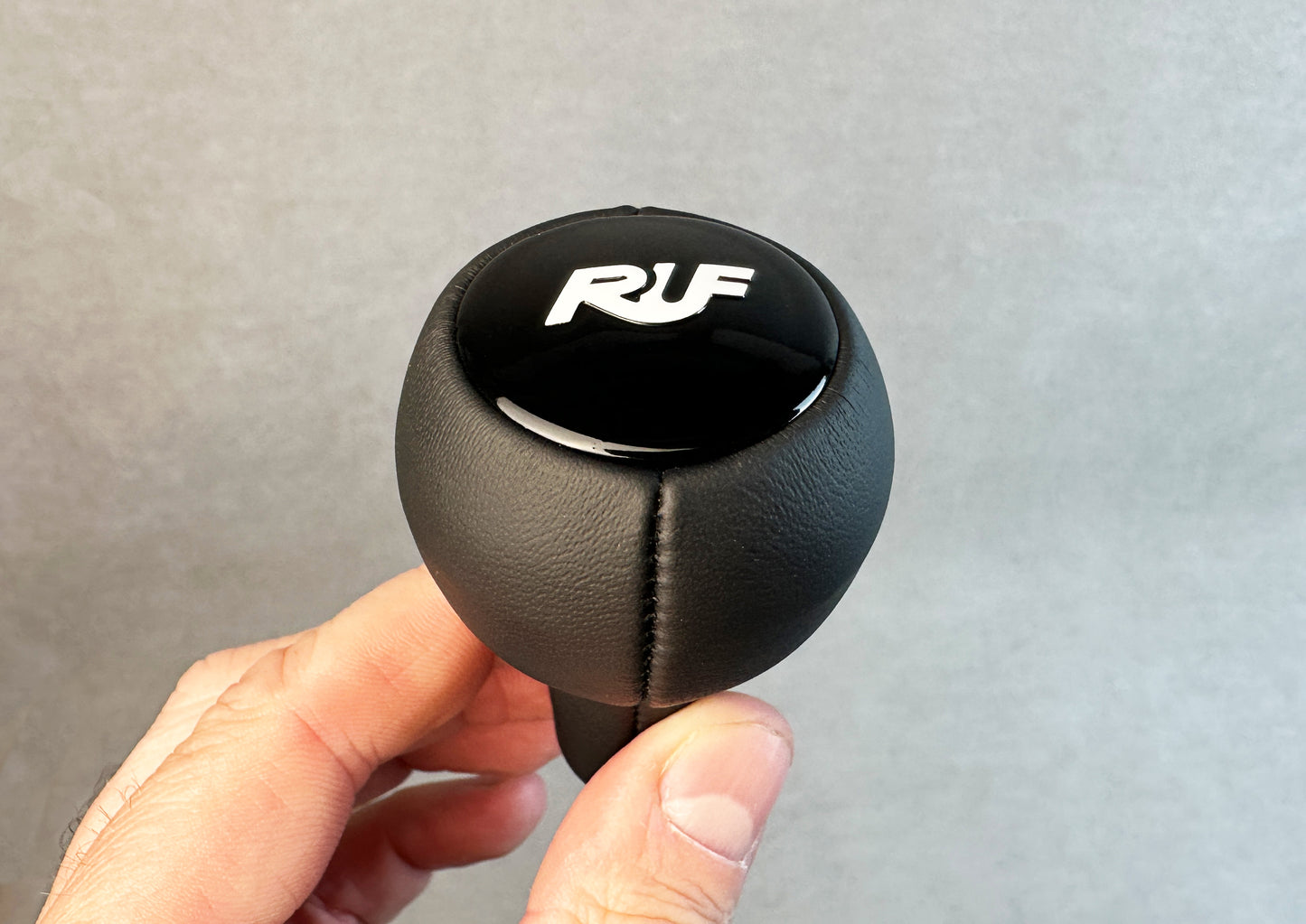 High-quality leather RUF G50 knob with gloss black/white logo