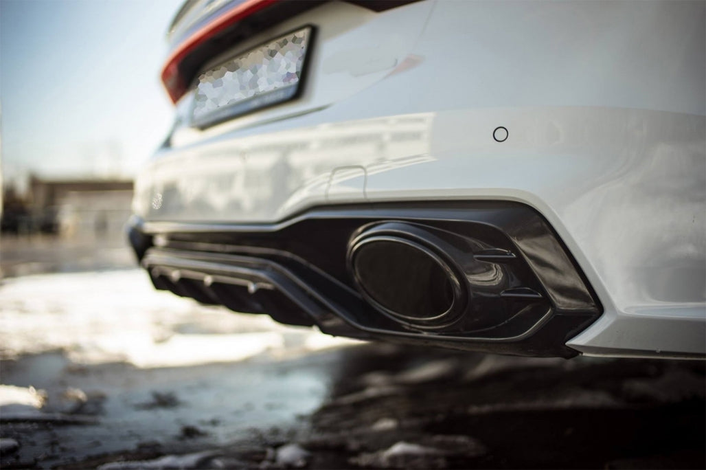 Universal carbon fiber exhaust muffler tip with polished finish and 6.2cm inlet, performance upgrade for any vehicle.