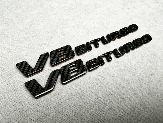 Close-up of V8 Biturbo carbon fender badge on Mercedes AMG
