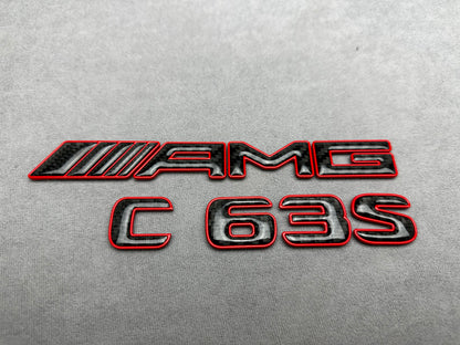 AMG C 63 S red metal with carbon emblem badge for Mercedes C-Class (W204, W205, W206), exterior styling upgrade