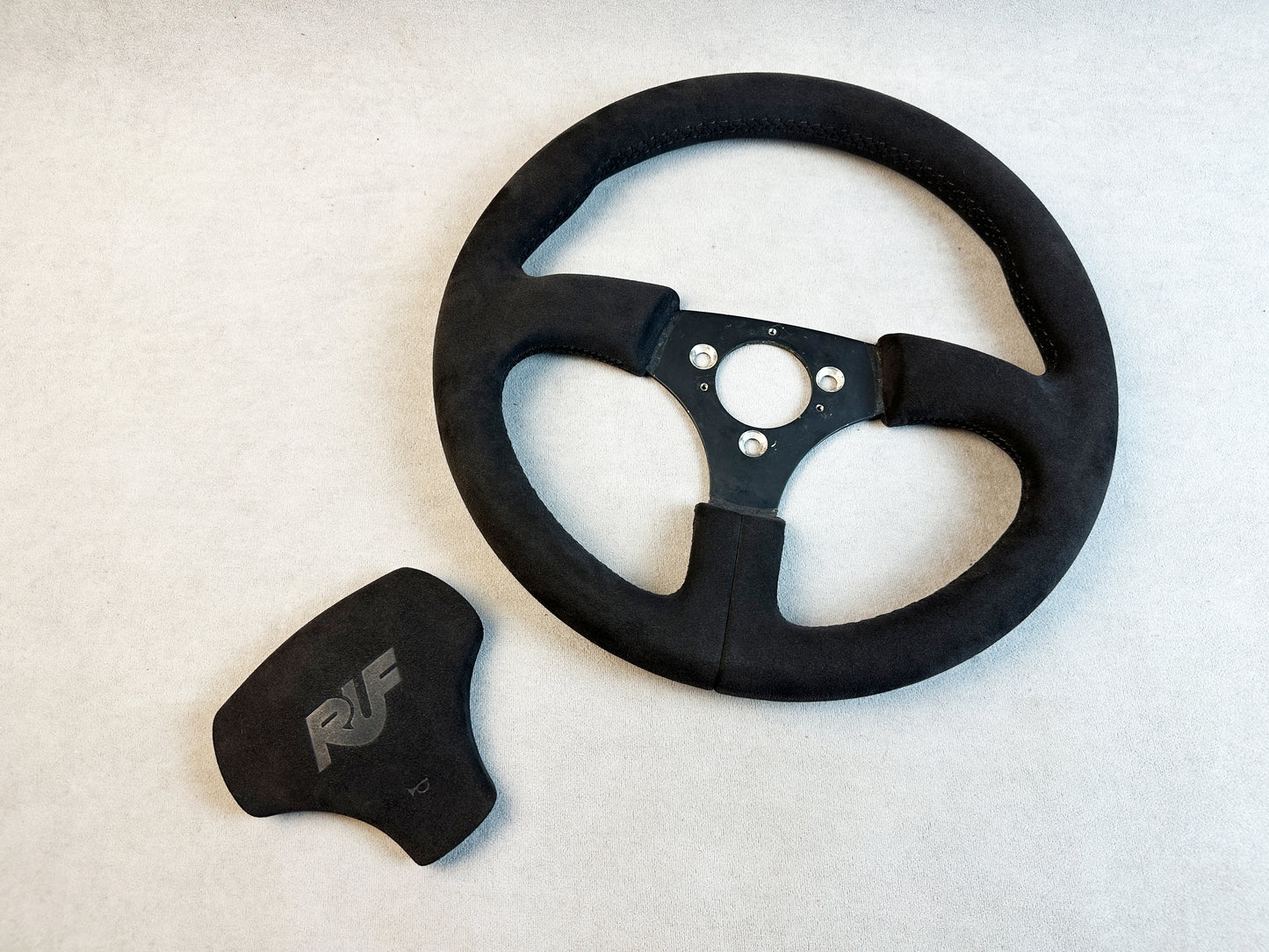 Porsche 964 race-inspired interior with black Alcantara wheel