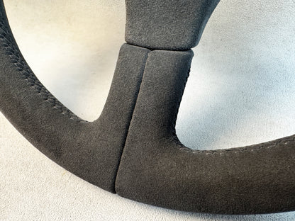 Motorsport-style Porsche wheel with grey stitched Alcantara