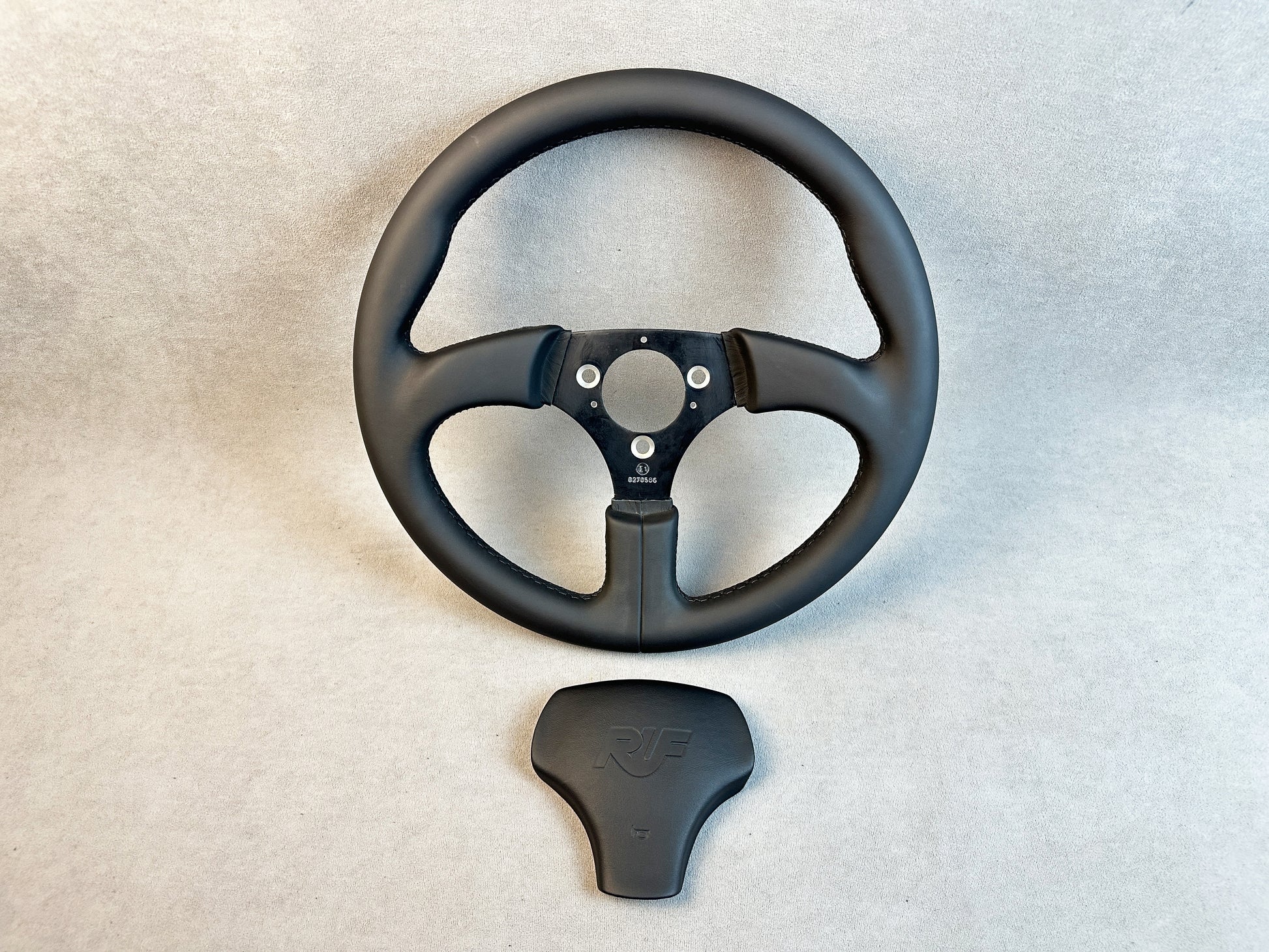 Top view showcasing leather texture and shape of spokes