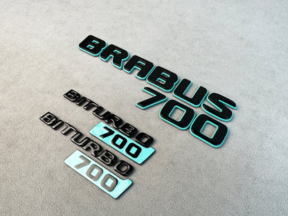 Biturbo 700 side emblems angled view on reflective surface