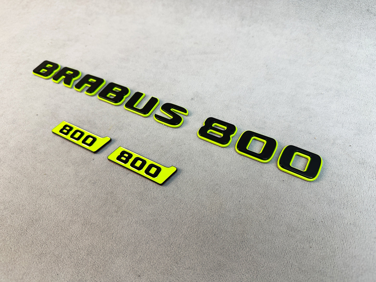 Metal BRABUS badge close-up on matte surface