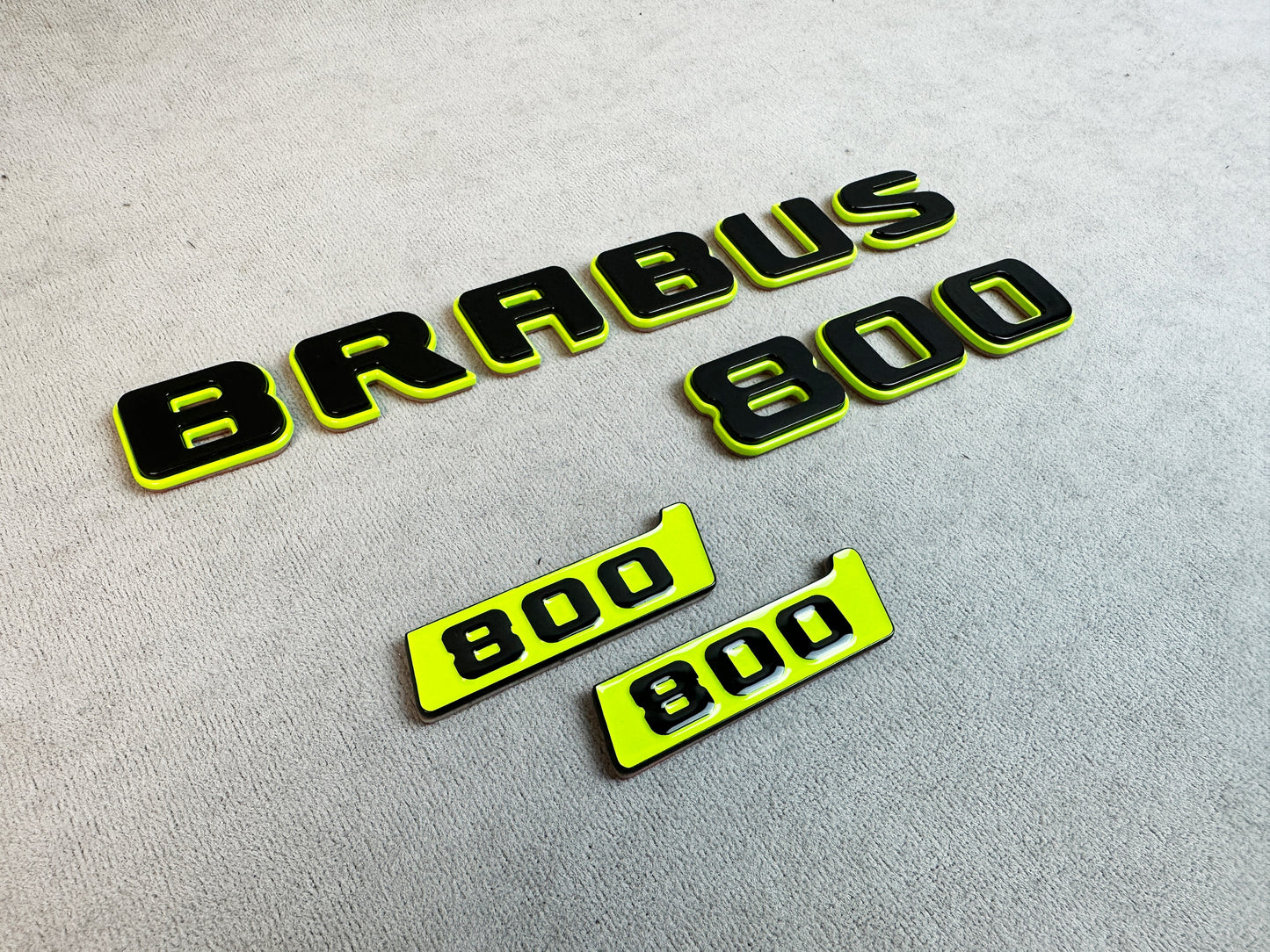 Pair of "800" fender badges shown on packaging