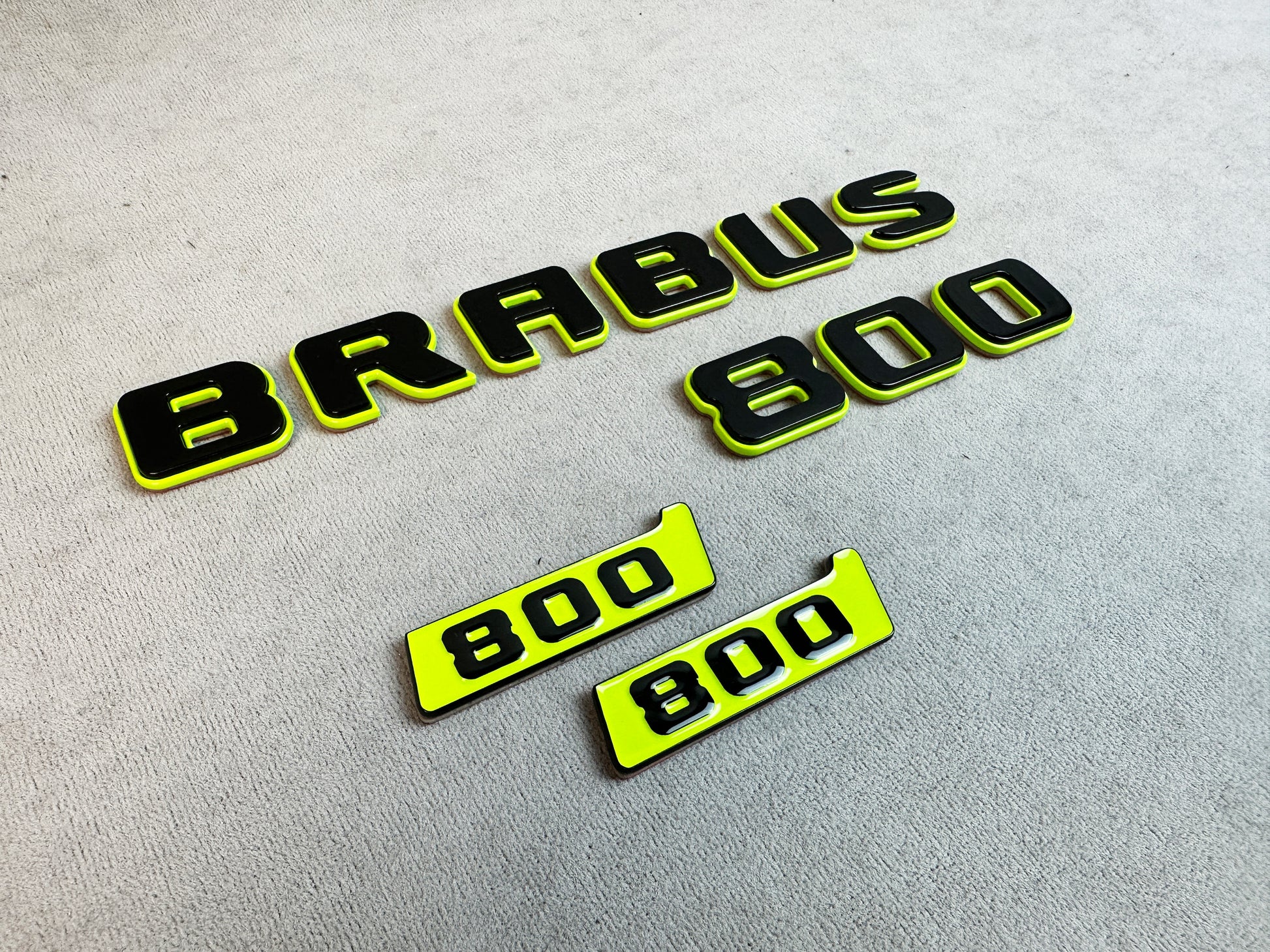 Pair of "800" fender badges shown on packaging