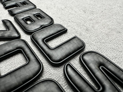 Brabus 700 carbon matte with metal trunk badge emblem for Mercedes, sleek and durable design for high-performance vehicles