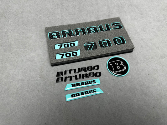 Brabus 700 Tiffany Blue with Carbon exterior emblems set for G-Wagon W463A W465, including trunk, Biturbo side badges, round B for hood, and Brabus insertions