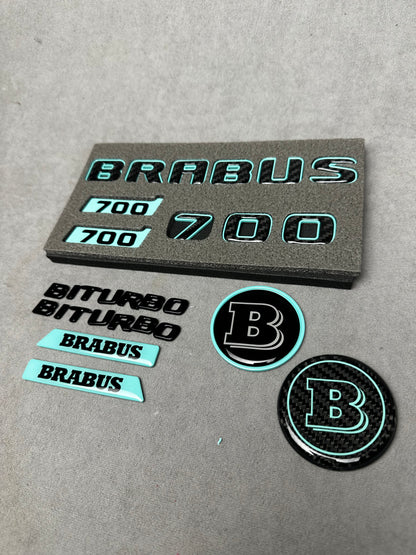 Brabus 700 Tiffany Blue with Carbon exterior emblems set for G-Wagon W463A W465, including trunk, Biturbo side badges, round B for hood, and Brabus insertions