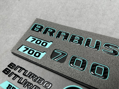 Brabus 700 Tiffany Blue with Carbon exterior emblems set for G-Wagon W463A W465, including trunk, Biturbo side badges, round B for hood, and Brabus insertions