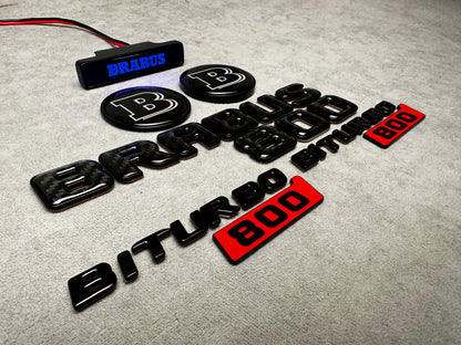 Close-up of Brabus 800 trunk emblem in carbon with metal finish
