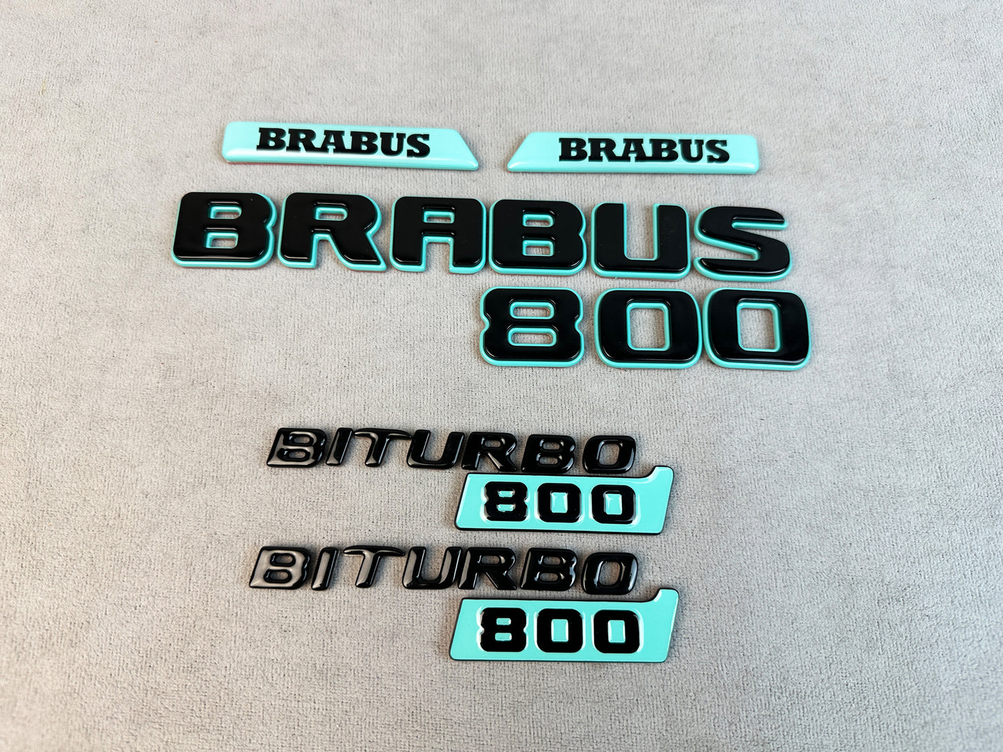 Gloss black Brabus 800 rear trunk badge with Tiffany Blue

