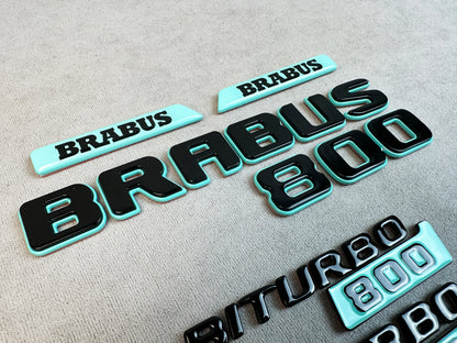 Complete badge kit laid out for Mercedes G-Class W463A
