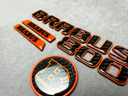 Brabus 800 orange metallic emblem badge with carbon fiber accents for Mercedes G-Wagon W463A, premium exterior upgrade