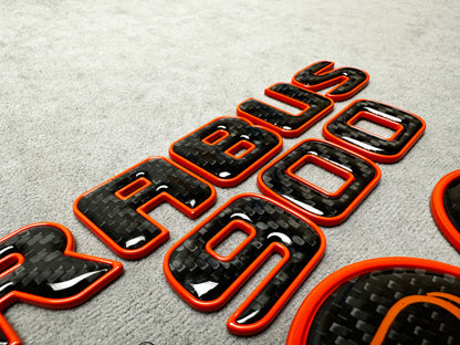 Brabus 900 Orange Metal and Carbon Emblem Set for Mercedes GT – Full badge set featuring premium metallic orange and carbon fiber finish