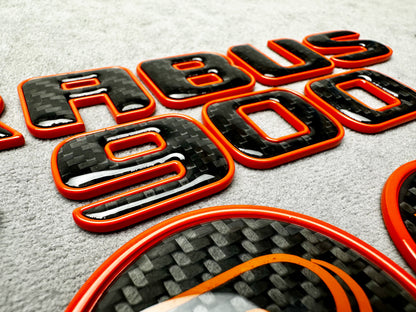 Brabus 900 Orange Metal and Carbon Emblem Set for Mercedes GT – Full badge set featuring premium metallic orange and carbon fiber finish