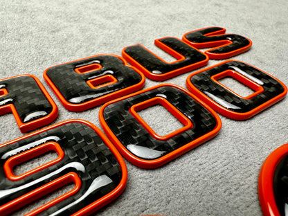 Brabus 900 Orange Metal and Carbon Emblem Set for Mercedes GT – Full badge set featuring premium metallic orange and carbon fiber finish