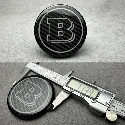 Brabus carbon grey emblem for Mercedes steering wheel, airbag logo with sleek design, perfect for G-W465, S-W223, GLE, and GLS models