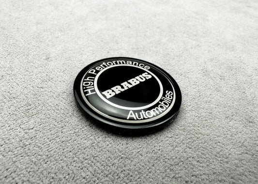 Close-up of Brabus black emblem on the front bumper of a Mercedes S-Class W223