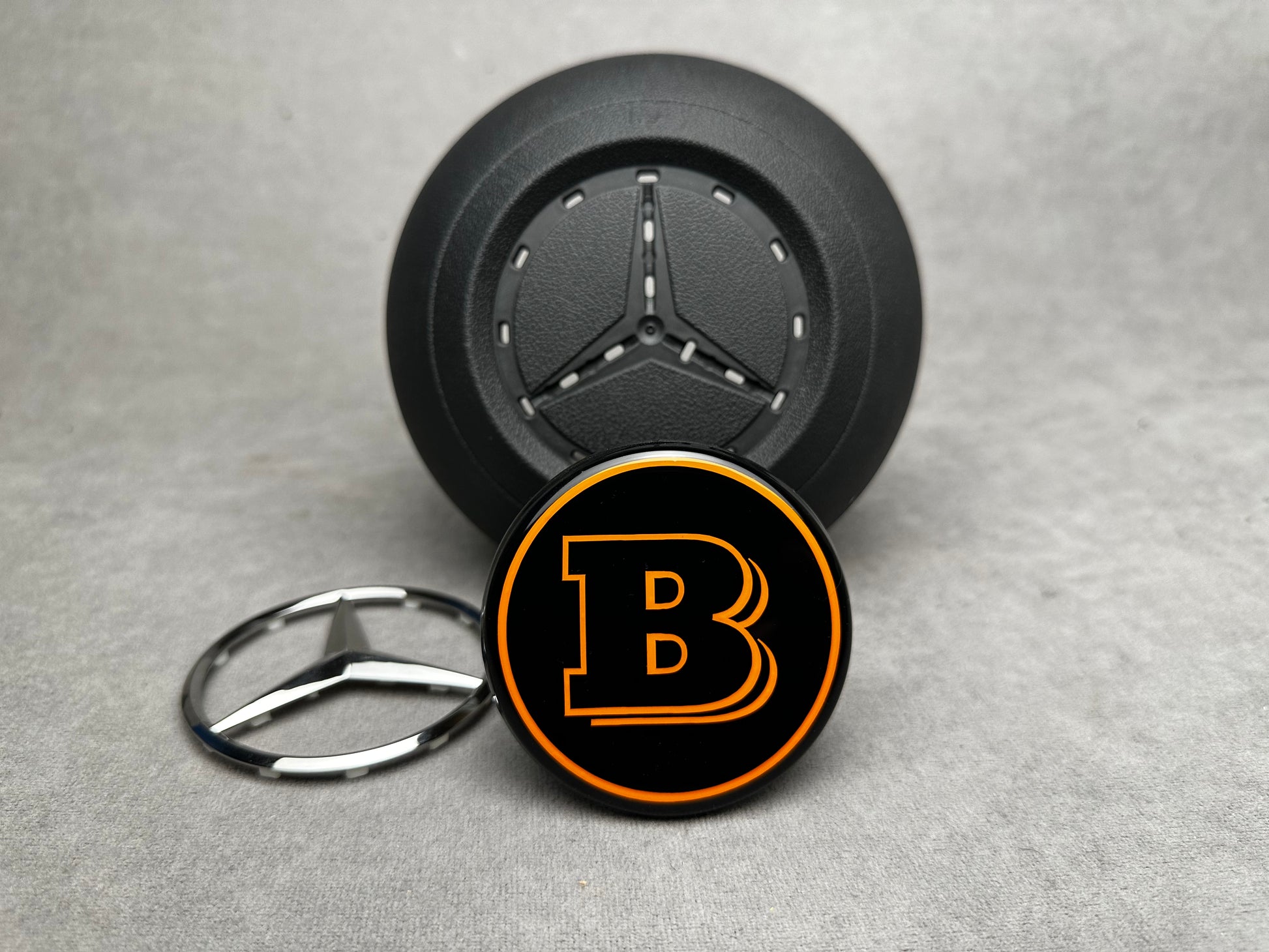 Brabus orange emblem for airbag steering wheel – 2024+ Mercedes G-W465, S-W223, GLE, GLS, premium quality