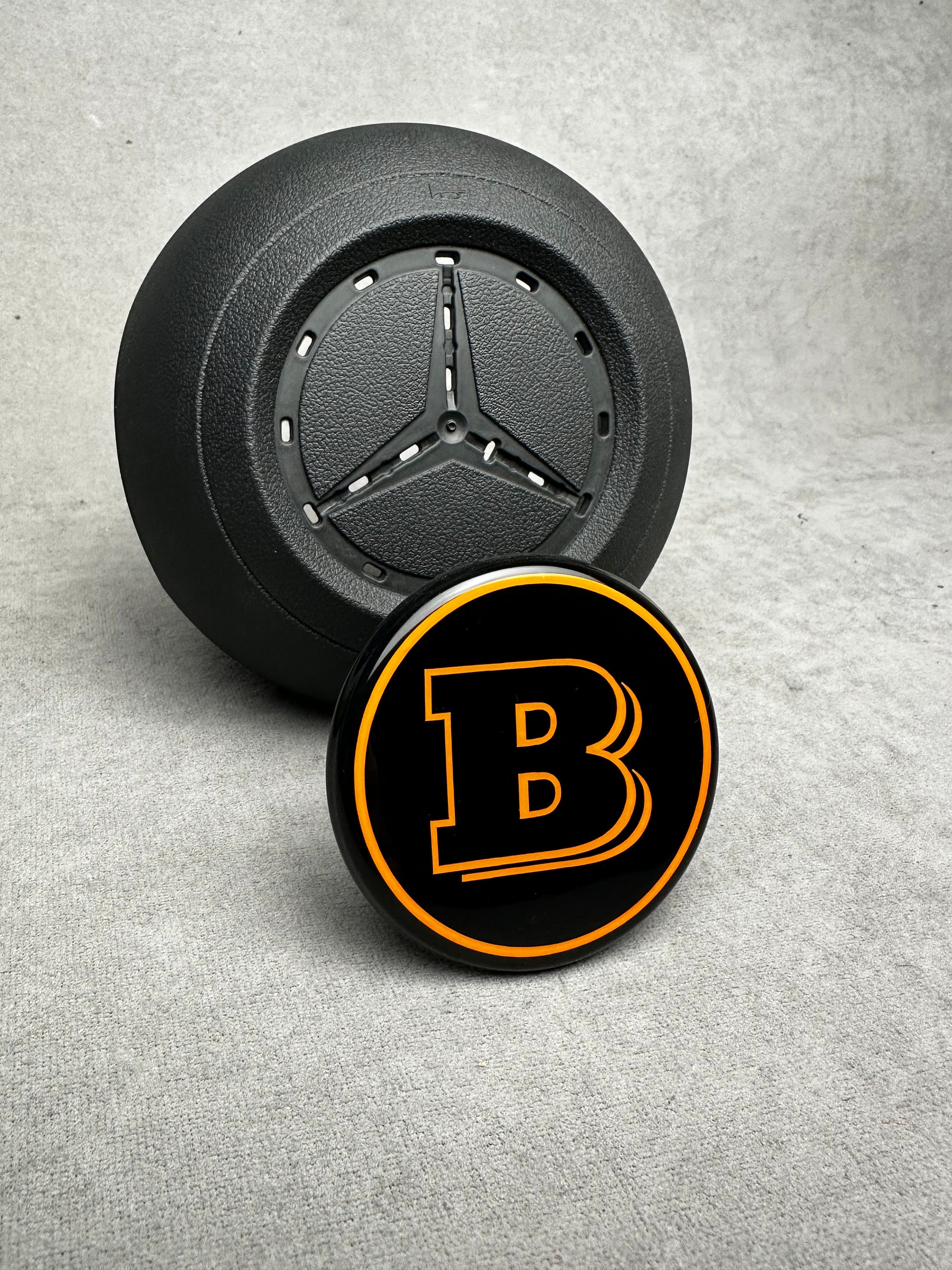 Brabus orange emblem for airbag steering wheel – 2024+ Mercedes G-W465, S-W223, GLE, GLS, premium quality