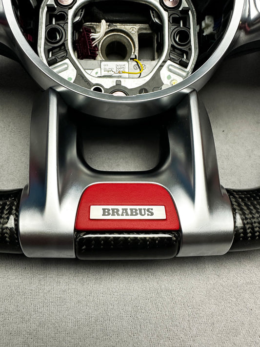 Close-up of Brabus Red Leather Steering Wheel Emblem with Metal Badge for Mercedes