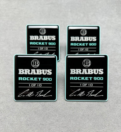 Close-up of Brabus Rocket 900 seat emblems with premium black finish and Tiffany blue lettering