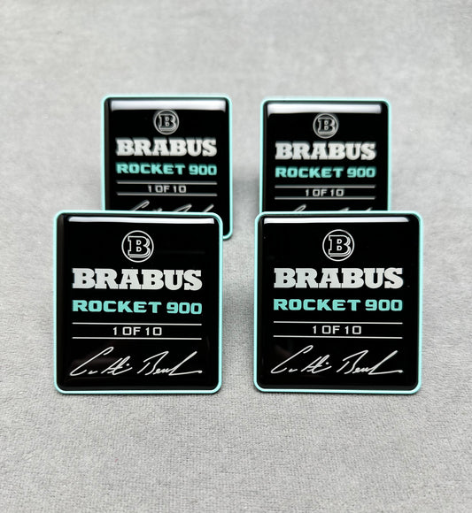 Close-up of Brabus Rocket 900 seat emblems with premium black finish and Tiffany blue lettering